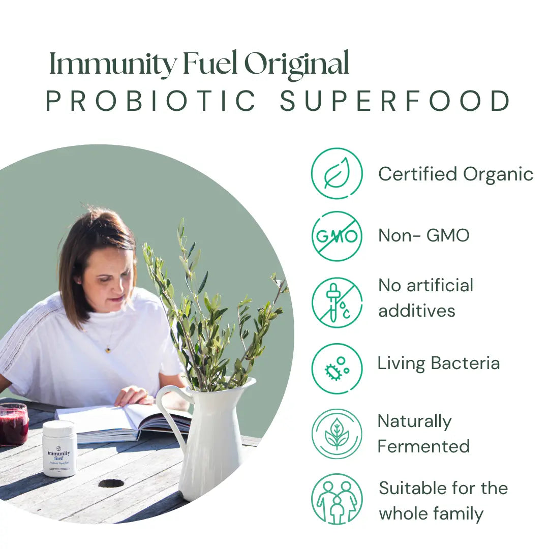 Promotional graphic for Immunity Fuel Original Probiotic Superfood, featuring a woman reading at a table on the left and a list of benefits on the right, including certified organic, non-GMO, no artificial additives, living bacteria, naturally fermented, and suitable for the whole family.