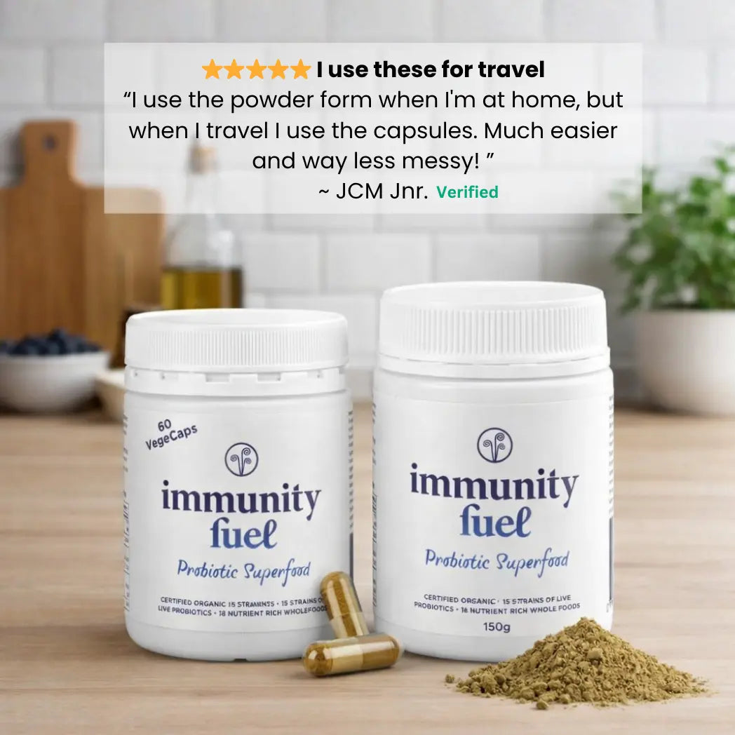 Two containers of 'immunity fuel' with powder on a wooden surface, featuring a customer review.