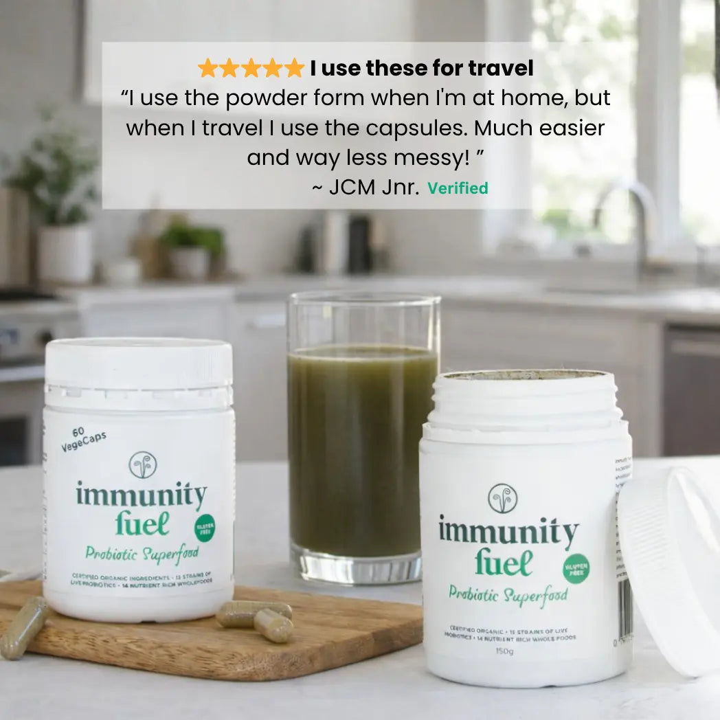 Two containers of 'immunity fuel' with a glass of green juice on a kitchen counter featuring a customer testimonial
