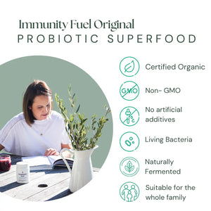 Promotional graphic for Immunity Fuel Original Probiotic Superfood, featuring a woman reading at a table on the left and a list of benefits on the right, including certified organic, non-GMO, no artificial additives, living bacteria, naturally fermented, and suitable for the whole family.